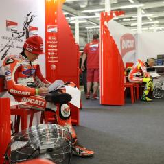 Going over the numbers in the cavernous Silverstone garage. - Photo: Milagro/Ducati