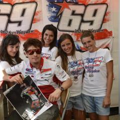 Nicky takes time out with the hard-working folks at his NH69 stand. - Photo: Ducati