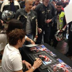 Nicky signs one of the many autographs he did at the event. - Photo: CJ