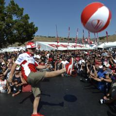 Nicky helped get the party going by sending some Ducati beach balls into the crowd. - Photo: Ducati